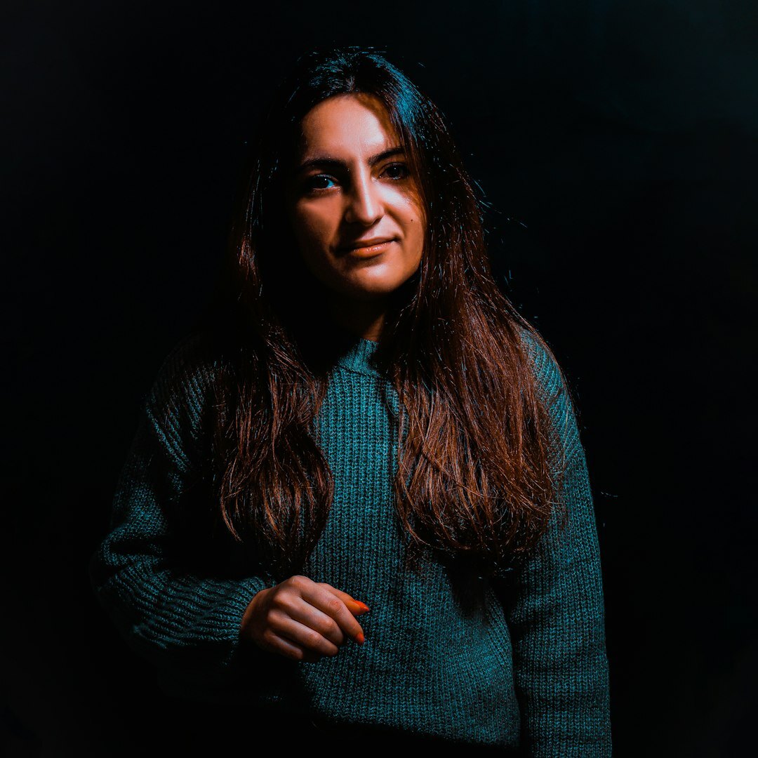 Studio portrait of a young woman with straight dark hair